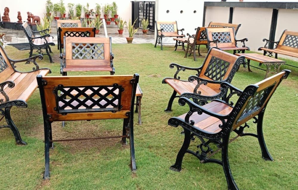 Lush landscaped open garden lawn facing New Marine Drive Puri